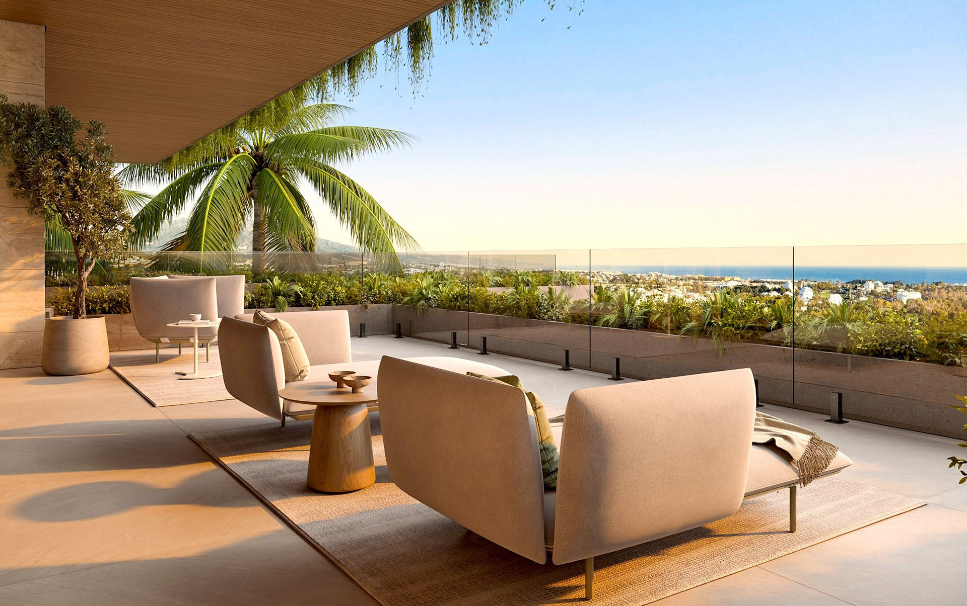 Nowoczesny taras z widokiem na nadmorskie miasto, komfortowe meble wypoczynkowe i bujna roślinność, idealne miejsce na relaks i spotkania na świeżym powietrzu.