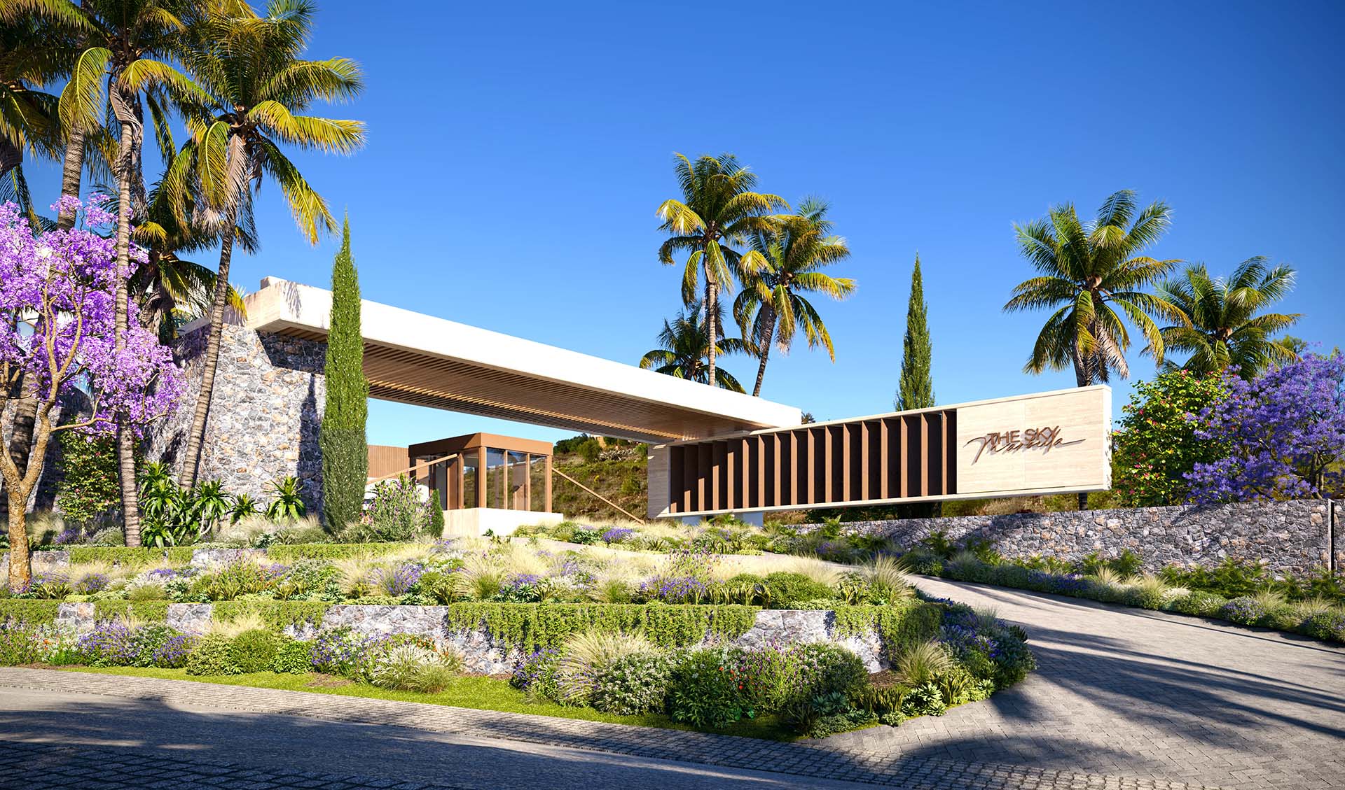 Elegancki wejście do luksusowego osiedla mieszkaniowego, otoczone palmami i egzotyczną roślinnością, w słoneczny dzień.